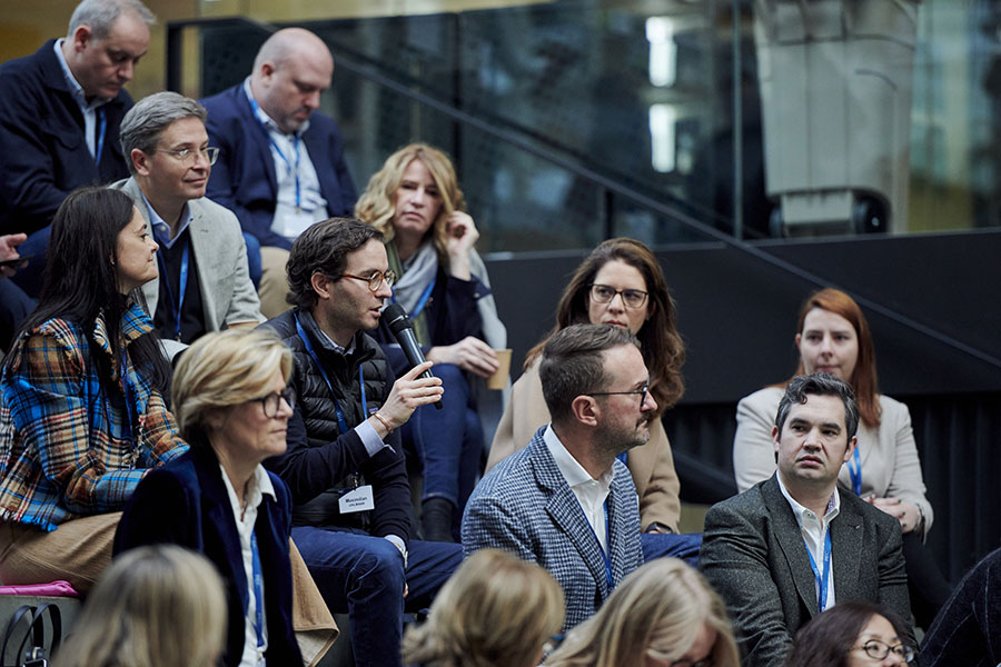 Sanofi executives engage in peer dialogue during a leadership development session at HEC Paris, exchanging ideas on data, strategy, and digital transformation.