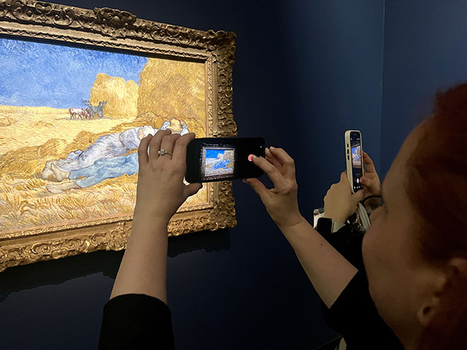 A participant from HEC Paris’ MSc in Change Leadership photographing a Van Gogh painting during a learning visit at the Musée d’Orsay, Paris, December 2025.
