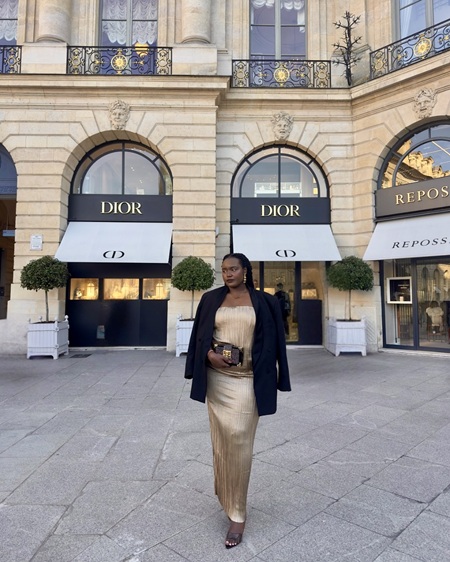 Aduh Kyalo wearing a gold dress in Paris