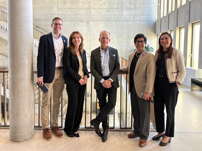 Frederic Obala group photo with HEC staff and an MBA student