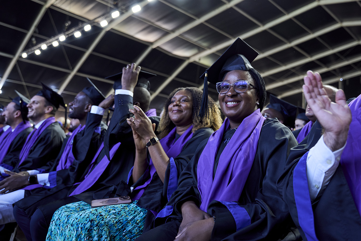 EMBA participants seated at graduation including Aminata Fofana in the foreground
