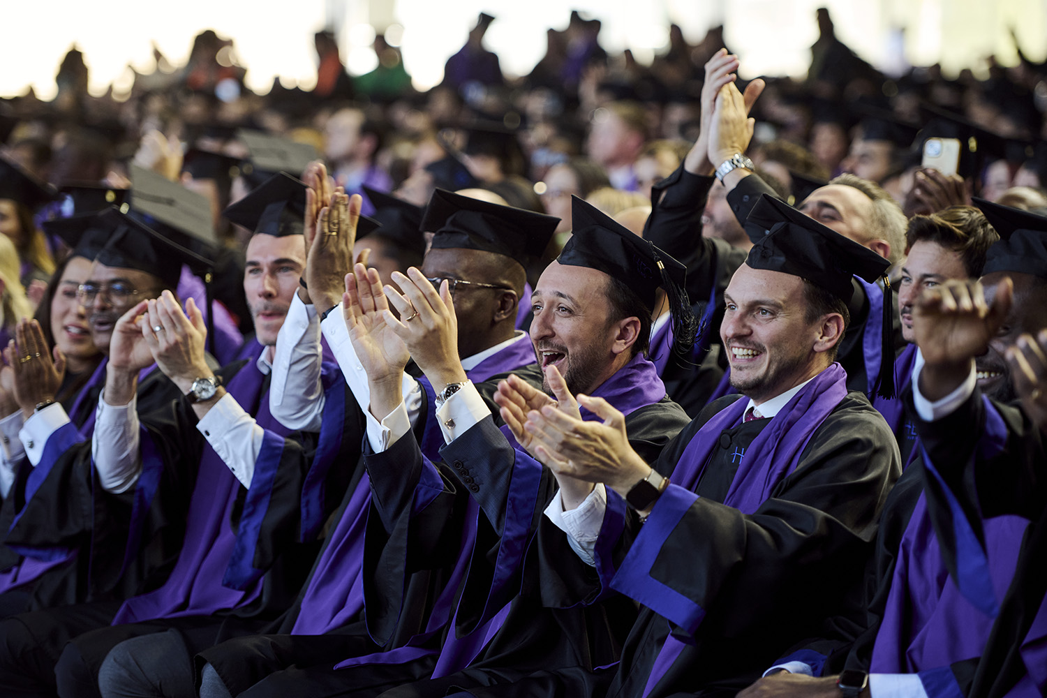 EMBA participants clapping at graduation 2026
