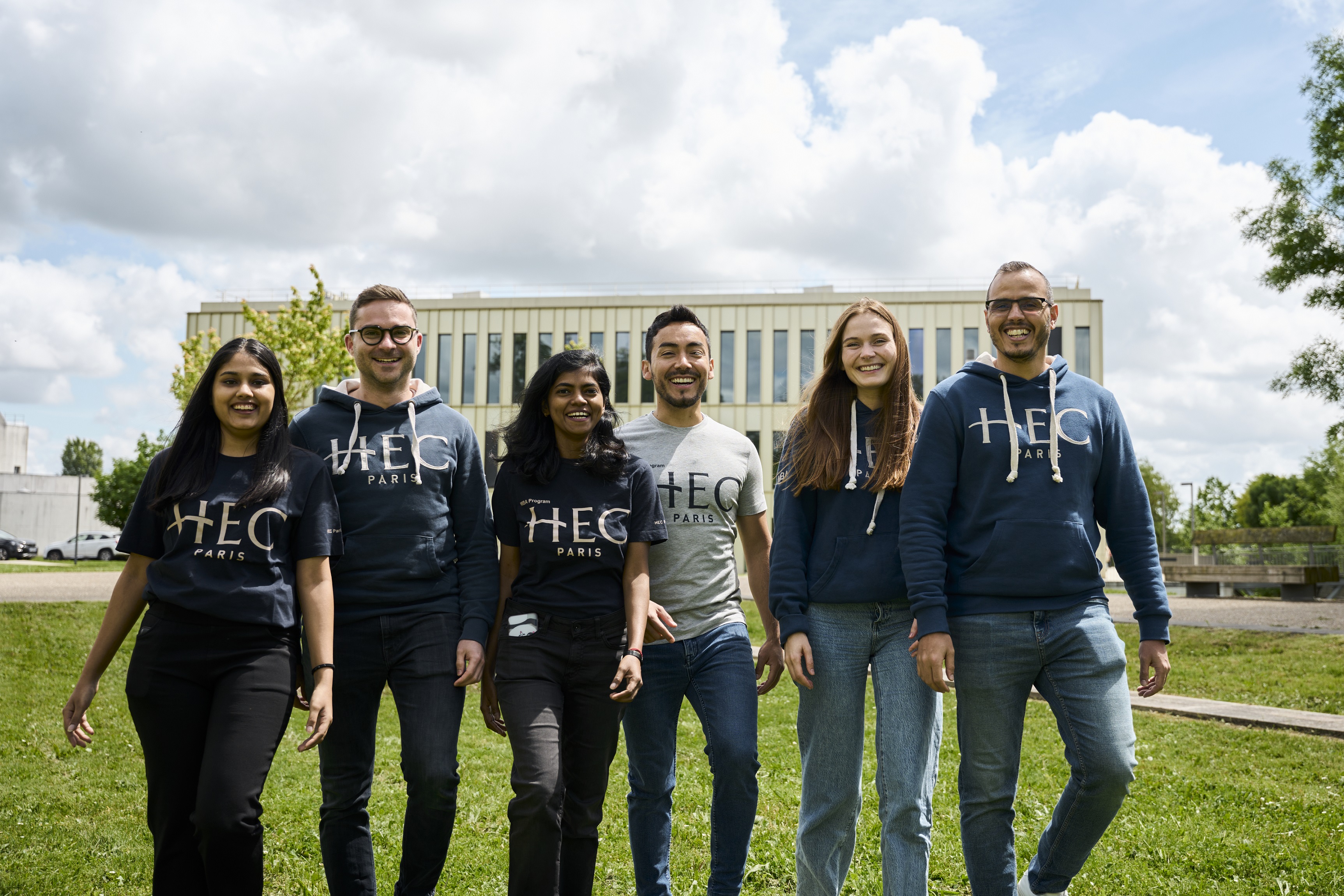 Photo of group of MBA students standing outside in HEC MBA hoodies