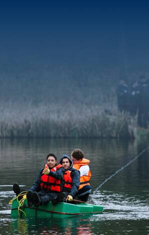 Students in a raft on the lake at HEC Paris