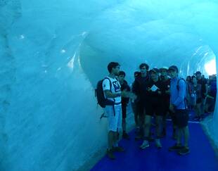 HEC Paris young students discovering an icecave in Mont-Blanc