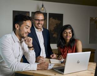 Students working in front of a laptop