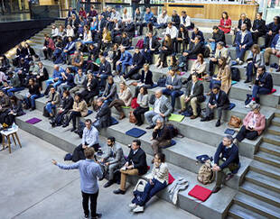 A wide view of Sanofi executives participating in a large-scale Drive Digital session at Station F, hosted by HEC Paris Executive Education, focused on digital and AI transformation.