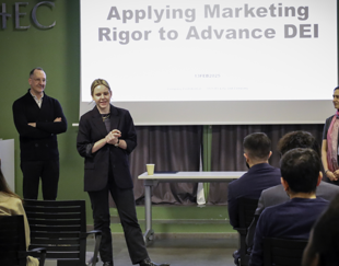 Sarah Shorhagen - HEC Paris MBA student and co-organizer of the event “Fostering DEI and Allyship at work” - introduces corporate executives from Eli Lilly Germany