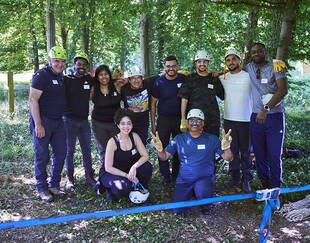 A group photo of EMBA students at forest grounds 