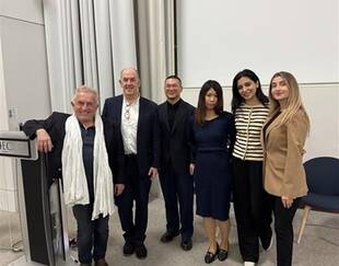 Professor Michel Safars and the HECEDA team pose for a group photo