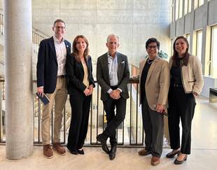 Frederic Obala group photo with HEC staff and an MBA student