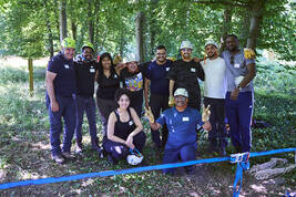 A group photo of EMBA students at forest grounds 