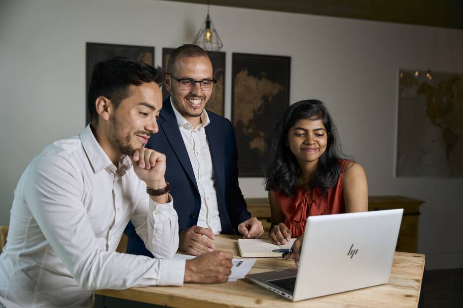 Students working in front of a laptop