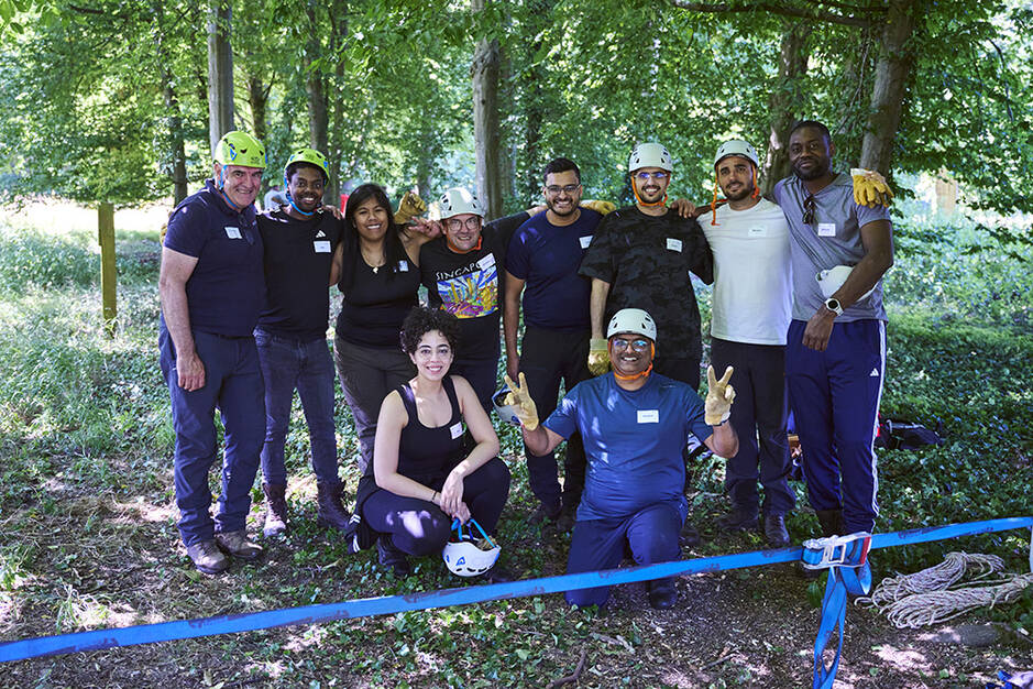 A group photo of EMBA students at forest grounds 