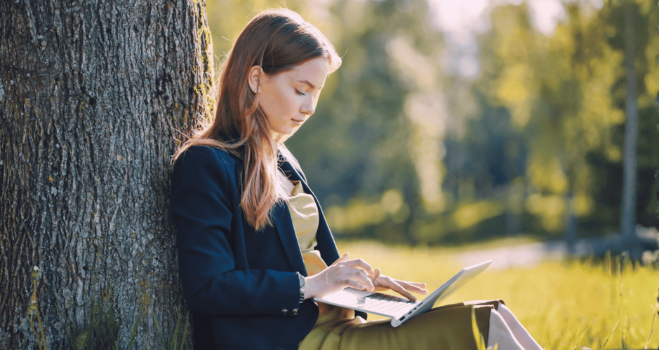 Student with laptop outside